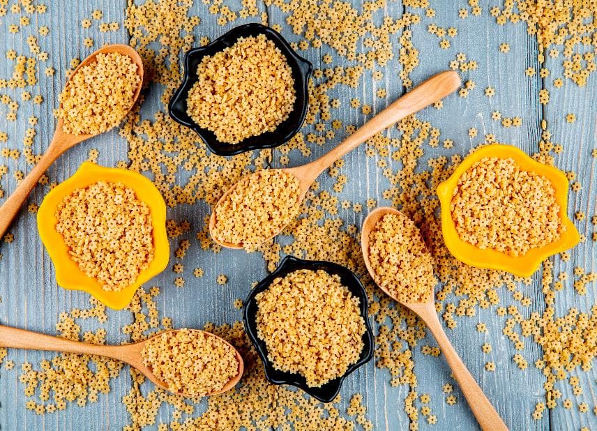 Millet grains in wooden bowls